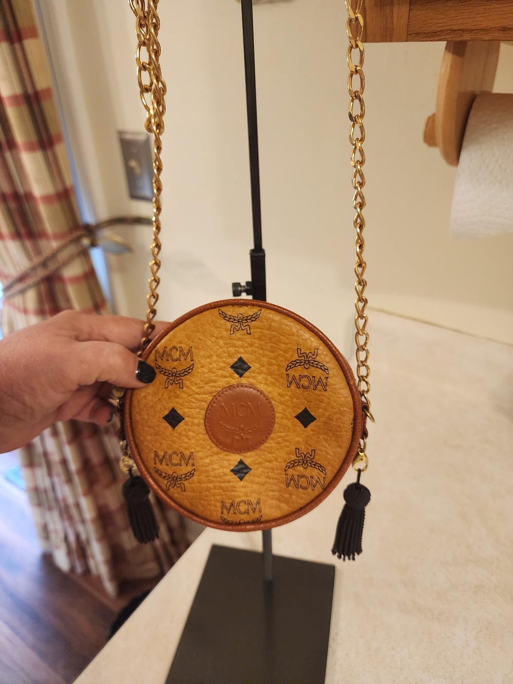 vintage MCM Suzy Wong Round Crossbody Bag. It features the brand's iconic cognac